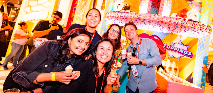 group of people smiling at camera outside of Adobe Max
